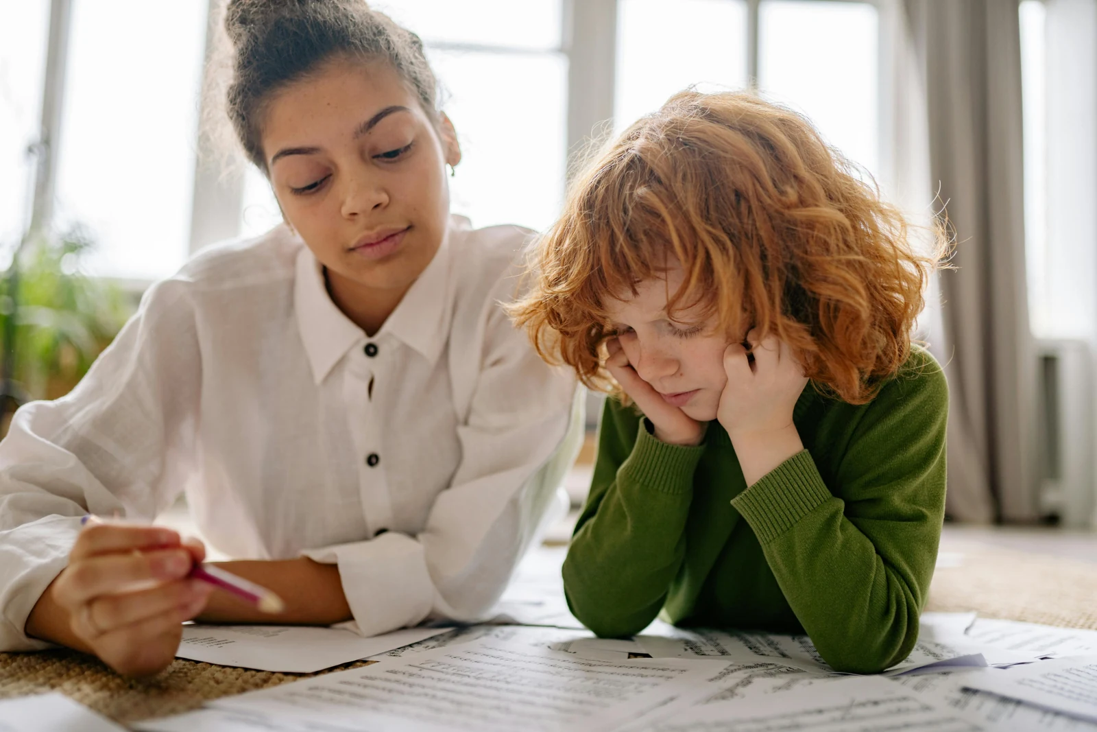 A student learning with an educator in a supportive setting