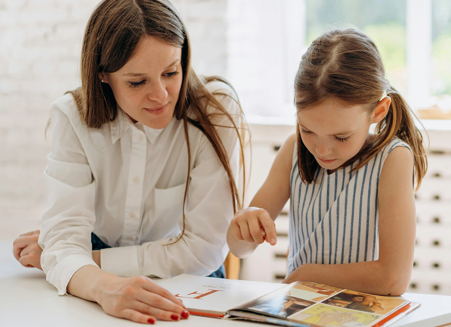 An educator supporting a child with one-to-one learning